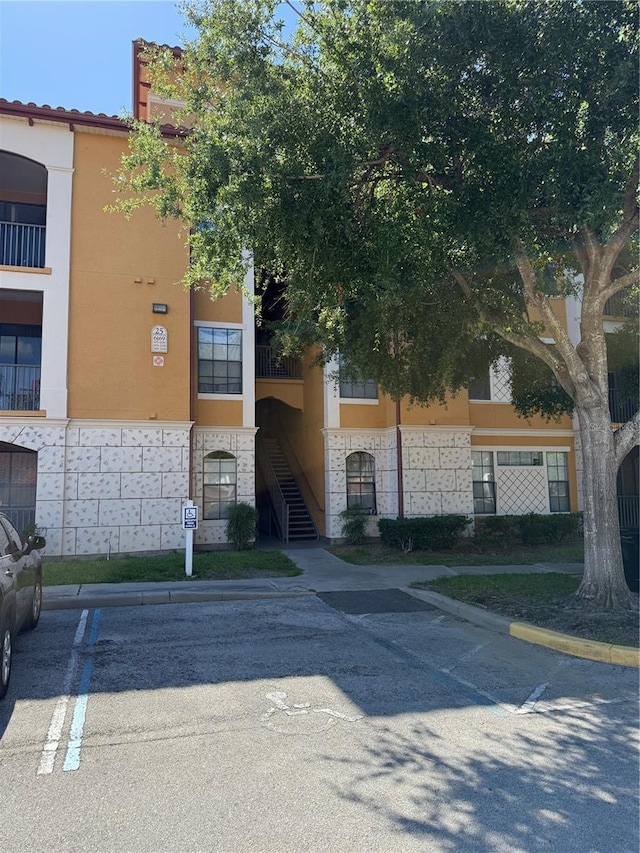 6169 Metrowest Blvd Unit 208, Orlando, FL 32835 - view of property with uncovered parking