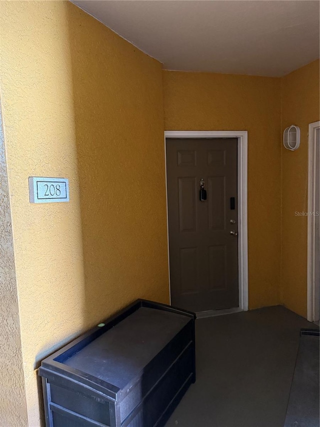 6169 Metrowest Blvd Unit 208, Orlando, FL 32835 - view of exterior entry featuring stucco siding