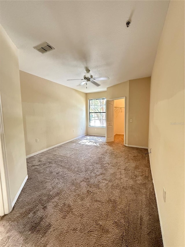 6169 Metrowest Blvd Unit 208, Orlando, FL 32835 - carpeted spare room featuring a ceiling fan, a pendent fire sprinkler, and a textured ceiling