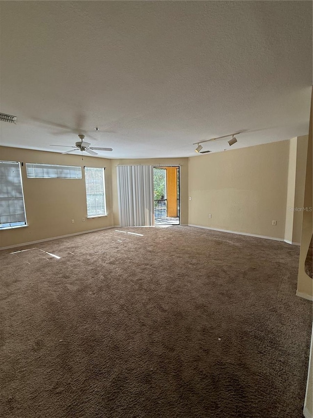 6169 Metrowest Blvd Unit 208, Orlando, FL 32835 - empty room featuring carpet floors, a textured ceiling, and ceiling fan