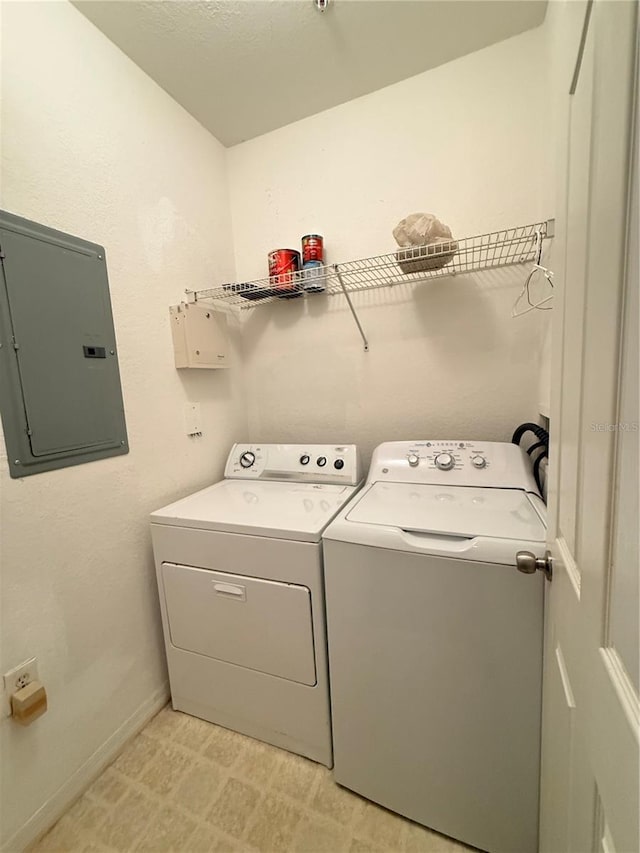 6169 Metrowest Blvd Unit 208, Orlando, FL 32835 - laundry area with electric panel, separate washer and dryer, and light flooring