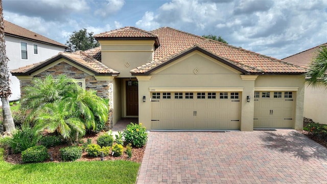 1353 Palmetto Dunes St, Davenport, FL 33836 - mediterranean / spanish home with stucco siding, a tiled roof, and a garage