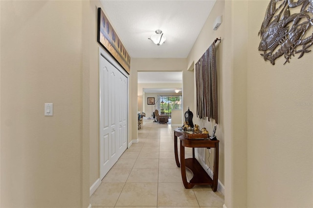1353 Palmetto Dunes St, Davenport, FL 33836 - hallway with light tile patterned flooring and baseboards