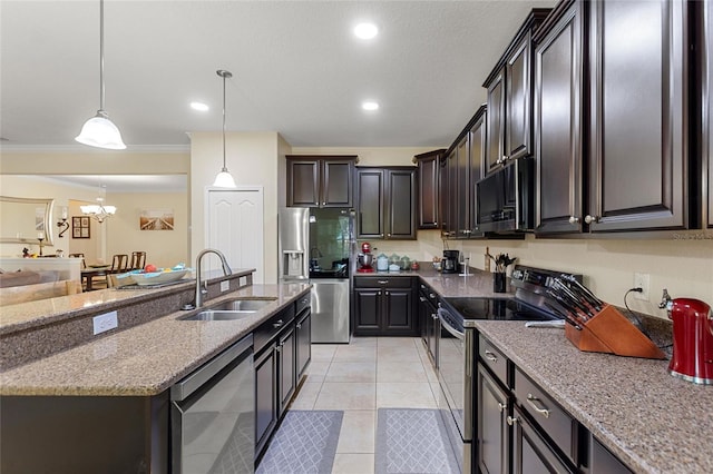 1353 Palmetto Dunes St, Davenport, FL 33836 - kitchen with appliances with stainless steel finishes, light stone counters, light tile patterned flooring, hanging light fixtures, and recessed lighting