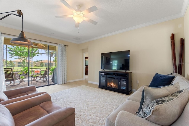 1353 Palmetto Dunes St, Davenport, FL 33836 - living area with ornamental molding, a ceiling fan, light tile patterned floors, and a glass covered fireplace