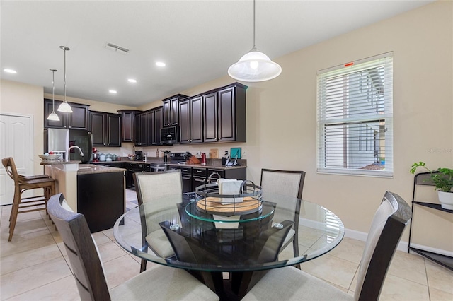 1353 Palmetto Dunes St, Davenport, FL 33836 - dining room featuring recessed lighting and light tile patterned flooring