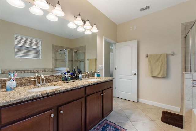 1353 Palmetto Dunes St, Davenport, FL 33836 - bathroom with a stall shower, tile patterned floors, and double vanity