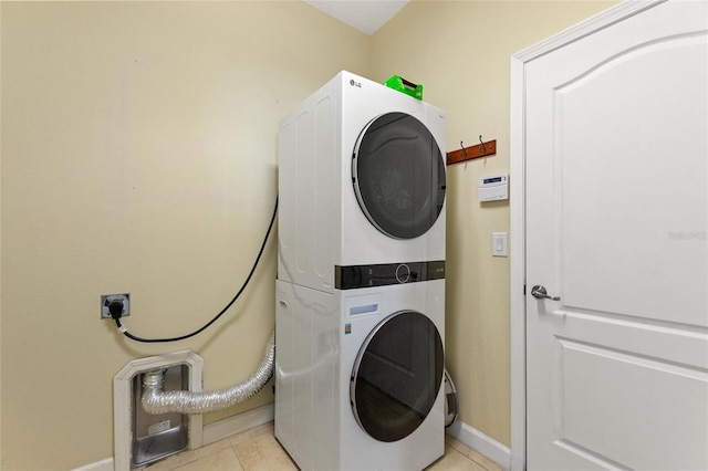 1353 Palmetto Dunes St, Davenport, FL 33836 - laundry room with stacked washer / drying machine and light tile patterned floors