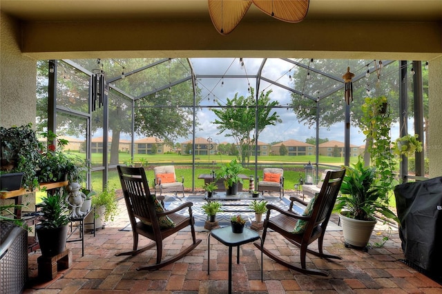 1353 Palmetto Dunes St, Davenport, FL 33836 - view of patio / terrace featuring glass enclosure, a residential view, area for grilling, and an outdoor hangout area