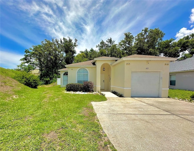453 Alston Dr, Orlando, FL 32835 - view of front facade with an attached garage, stucco siding, concrete driveway, and a front lawn