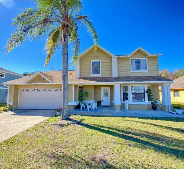 416 Sea Willow Dr, Kissimmee, FL 34743 - traditional-style house featuring concrete driveway, an attached garage, and a front yard