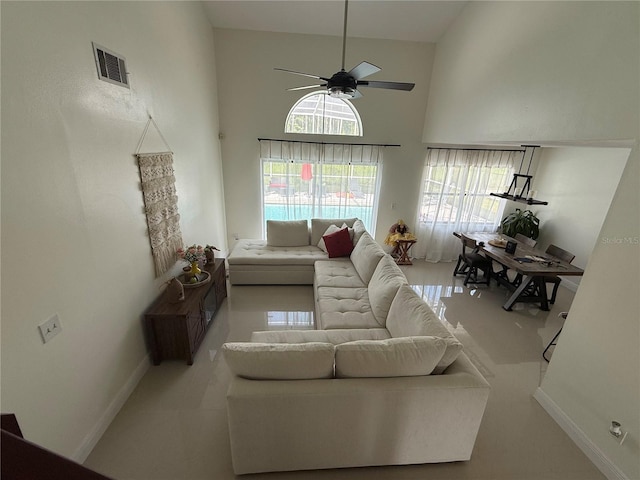 416 Sea Willow Dr, Kissimmee, FL 34743 - living room with a ceiling fan and a towering ceiling