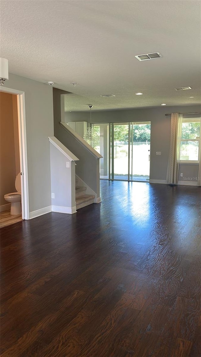 2813 Roseglen Way, Orlando, FL 32812 - unfurnished room with dark wood finished floors, stairway, and recessed lighting