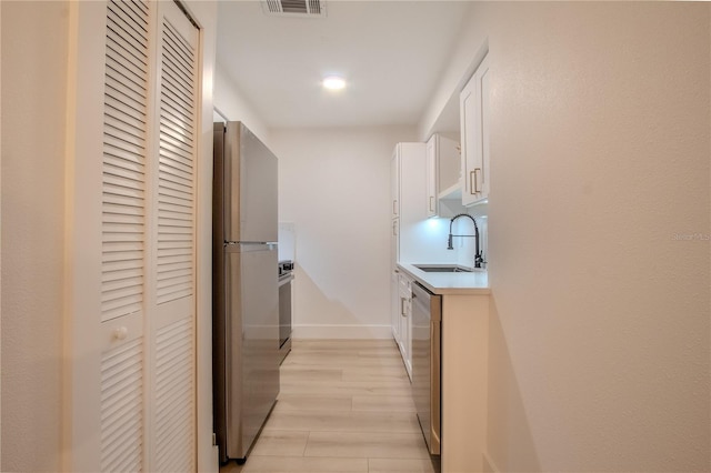 4768 Tangerine Ave Unit 4768, Winter Park, FL 32792 - hall featuring a sink and light wood-type flooring
