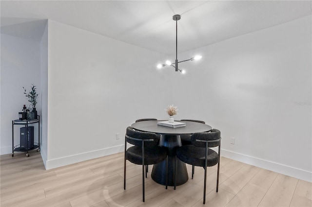 4768 Tangerine Ave Unit 4768, Winter Park, FL 32792 - dining room with a chandelier and light wood-style flooring