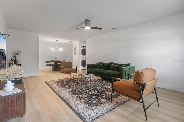 4768 Tangerine Ave Unit 4768, Winter Park, FL 32792 - living area featuring stacked washer / drying machine, ceiling fan, and light wood finished floors