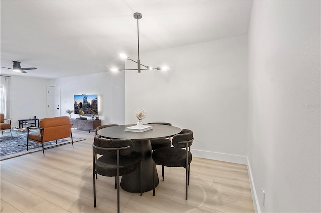 4768 Tangerine Ave Unit 4768, Winter Park, FL 32792 - dining area with light wood-style floors and baseboards
