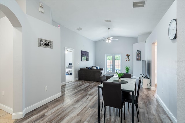 1659 Sage Creek Ct, Orlando, FL 32824 - dining space with vaulted ceiling, a ceiling fan, wood finished floors, and baseboards