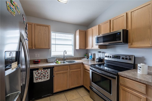 1659 Sage Creek Ct, Orlando, FL 32824 - kitchen featuring appliances with stainless steel finishes, a sink, light brown cabinets, light tile patterned floors, and light countertops