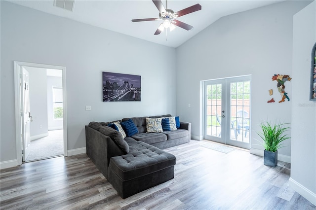 1659 Sage Creek Ct, Orlando, FL 32824 - living room with french doors, wood finished floors, a ceiling fan, baseboards, and high vaulted ceiling