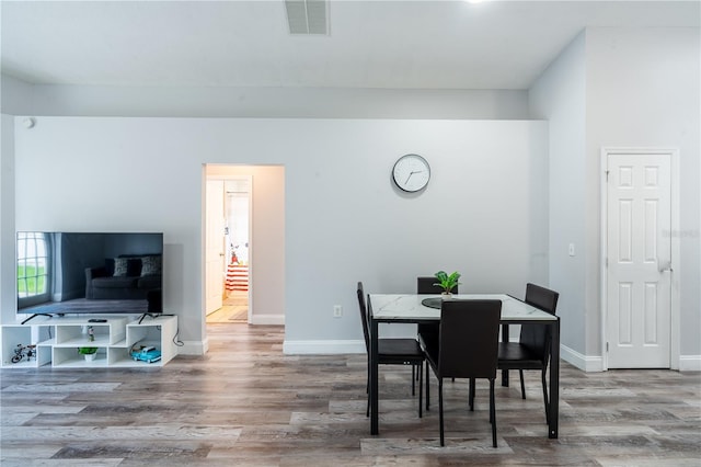 1659 Sage Creek Ct, Orlando, FL 32824 - dining area with wood finished floors and baseboards