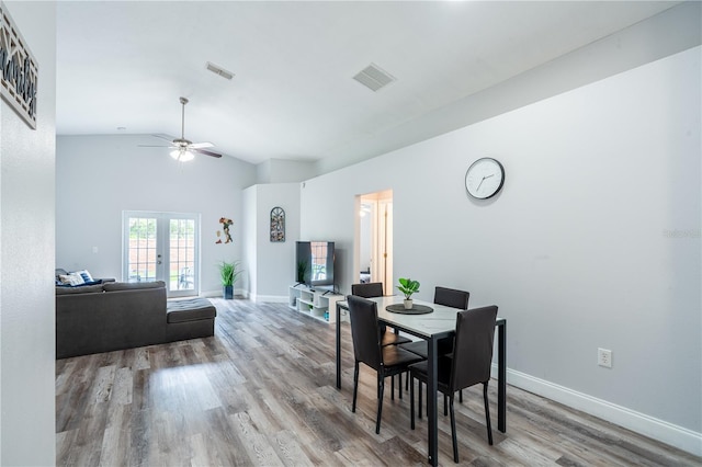 1659 Sage Creek Ct, Orlando, FL 32824 - dining room featuring vaulted ceiling, wood finished floors, a ceiling fan, baseboards, and french doors
