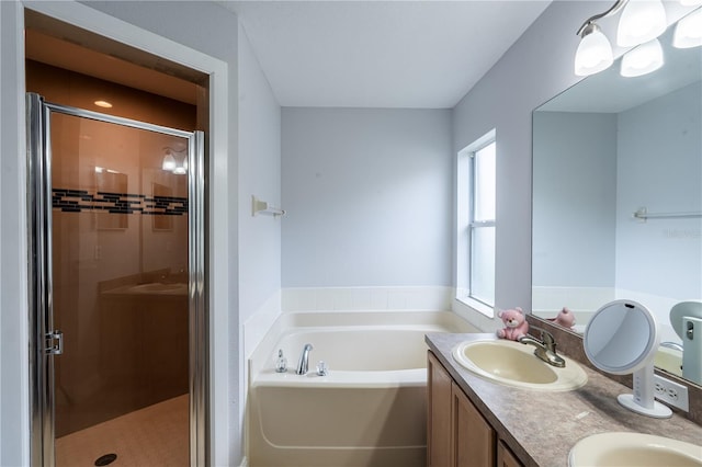 1659 Sage Creek Ct, Orlando, FL 32824 - bathroom featuring a stall shower, a garden tub, and double vanity