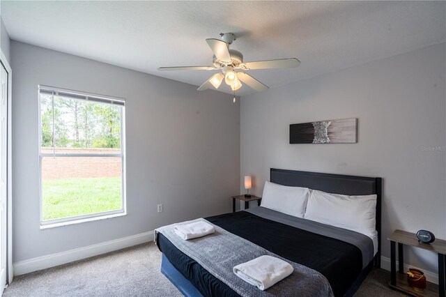 1659 Sage Creek Ct, Orlando, FL 32824 - bedroom featuring carpet flooring, baseboards, and ceiling fan
