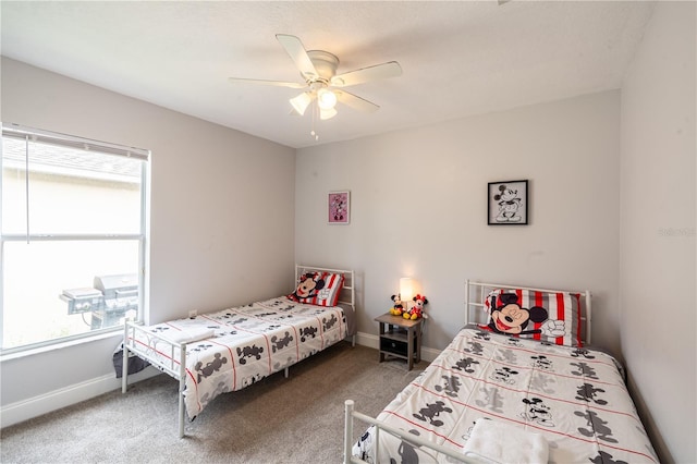 1659 Sage Creek Ct, Orlando, FL 32824 - carpeted bedroom with multiple windows, baseboards, and ceiling fan