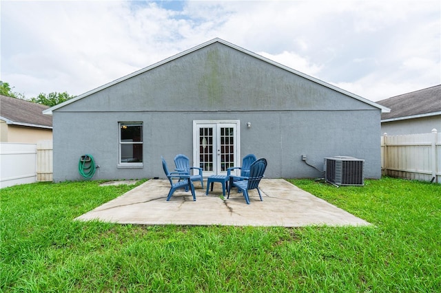 1659 Sage Creek Ct, Orlando, FL 32824 - rear view of property featuring central AC, a patio area, stucco siding, and french doors