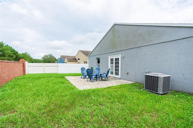 1659 Sage Creek Ct, Orlando, FL 32824 - view of yard featuring cooling unit, a patio area, and french doors