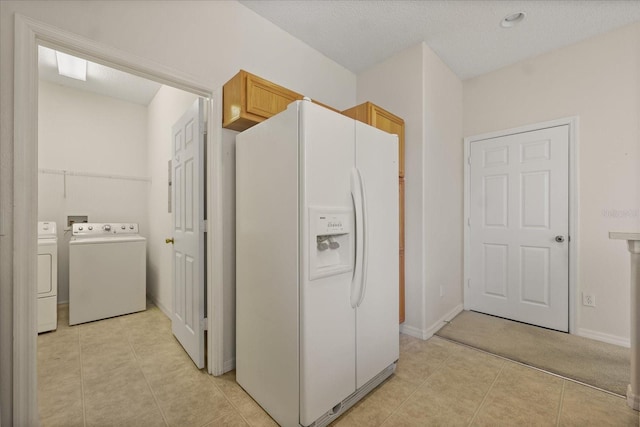 2050 Island Walk Dr, Orlando, FL 32824 - kitchen with white fridge with ice dispenser, washer and dryer, and light tile patterned flooring