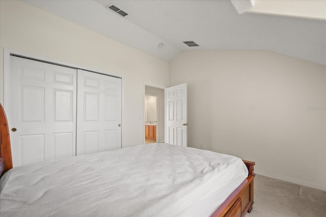 2050 Island Walk Dr, Orlando, FL 32824 - bedroom with light carpet, vaulted ceiling, and a closet