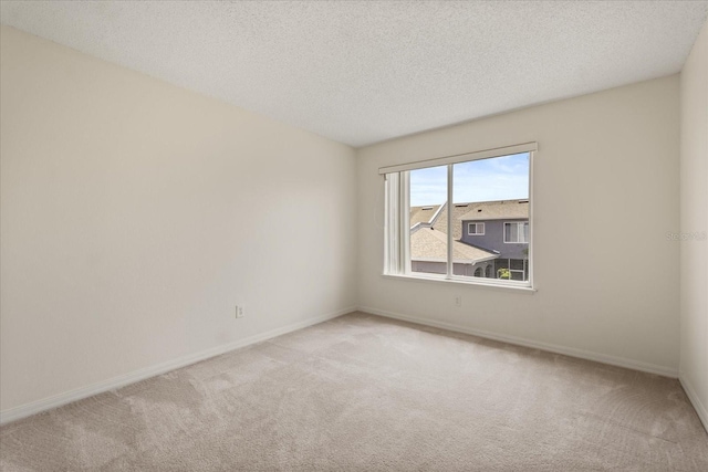 2050 Island Walk Dr, Orlando, FL 32824 - empty room featuring light carpet and a textured ceiling