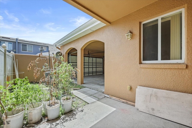 2050 Island Walk Dr, Orlando, FL 32824 - doorway to property with stucco siding and a patio
