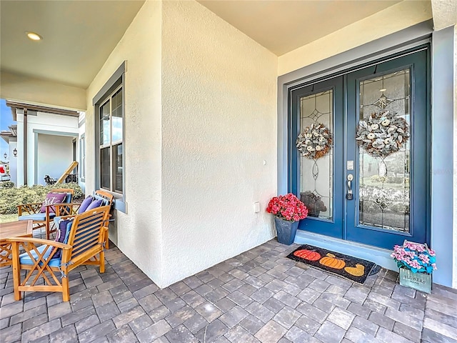 9071 Woodland Forest Rd, Orlando, FL 32836 - property entrance with french doors and stucco siding