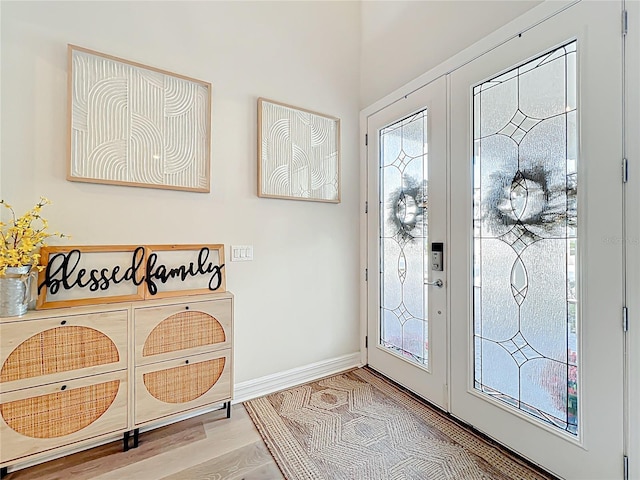 9071 Woodland Forest Rd, Orlando, FL 32836 - foyer with baseboards and wood finished floors