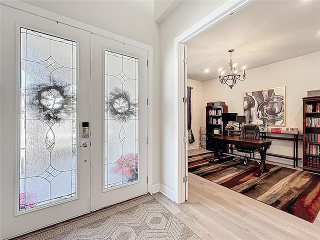 9071 Woodland Forest Rd, Orlando, FL 32836 - foyer entrance featuring wood finished floors and a chandelier