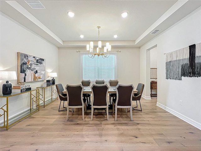 9071 Woodland Forest Rd, Orlando, FL 32836 - dining area with a raised ceiling, a chandelier, light wood-style flooring, and recessed lighting