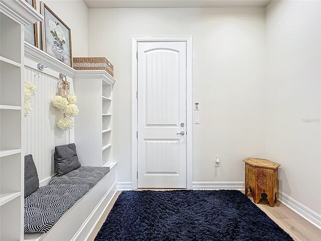9071 Woodland Forest Rd, Orlando, FL 32836 - mudroom with wood finished floors and baseboards