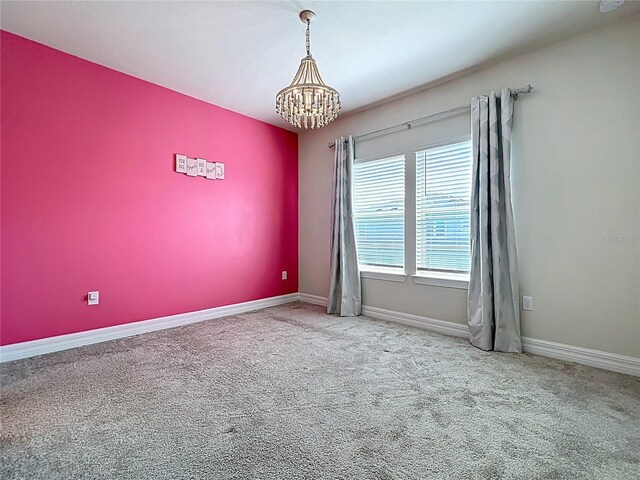 9071 Woodland Forest Rd, Orlando, FL 32836 - carpeted spare room featuring a chandelier and baseboards