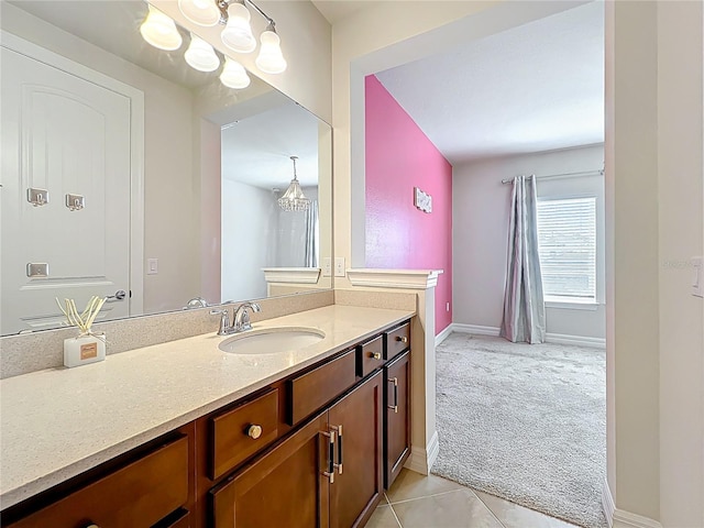 9071 Woodland Forest Rd, Orlando, FL 32836 - bathroom with vanity, a chandelier, and tile patterned flooring