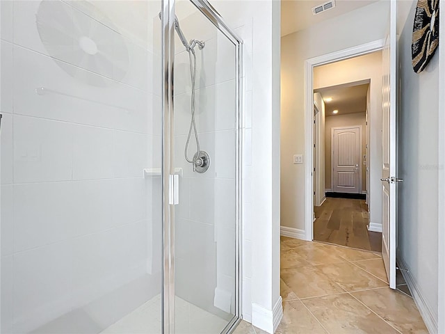 9071 Woodland Forest Rd, Orlando, FL 32836 - bathroom featuring a shower stall and baseboards