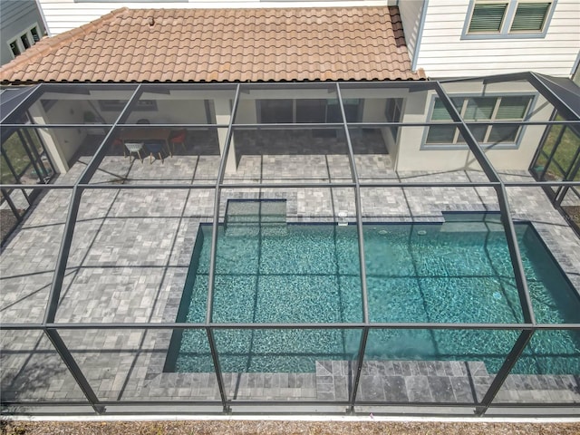 9071 Woodland Forest Rd, Orlando, FL 32836 - outdoor pool featuring a patio and glass enclosure