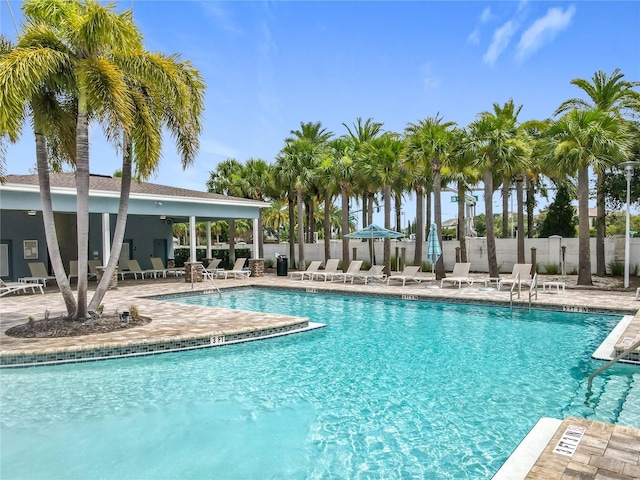 9071 Woodland Forest Rd, Orlando, FL 32836 - community pool featuring a patio area