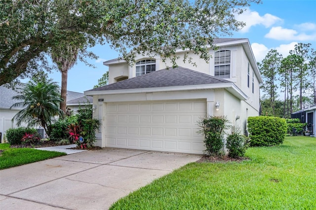 909 Troon Cir, Davenport, FL 33897 - traditional-style home with stucco siding, roof with shingles, concrete driveway, a front yard, and an attached garage