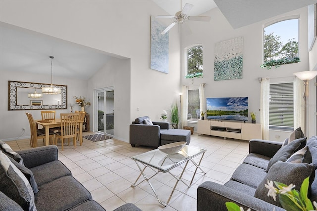 909 Troon Cir, Davenport, FL 33897 - living room with high vaulted ceiling, a chandelier, light tile patterned flooring, and a ceiling fan