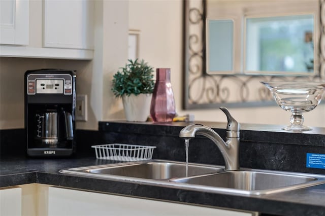 909 Troon Cir, Davenport, FL 33897 - kitchen view of white cabinetry and dark countertops