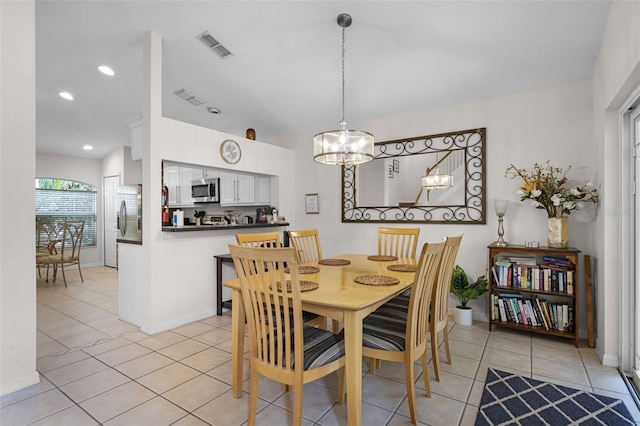 909 Troon Cir, Davenport, FL 33897 - dining room with a chandelier, light tile patterned floors, and recessed lighting