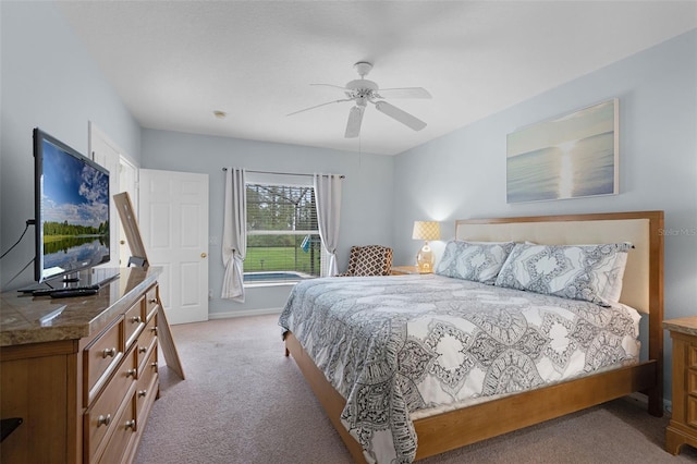 909 Troon Cir, Davenport, FL 33897 - bedroom featuring light carpet and ceiling fan